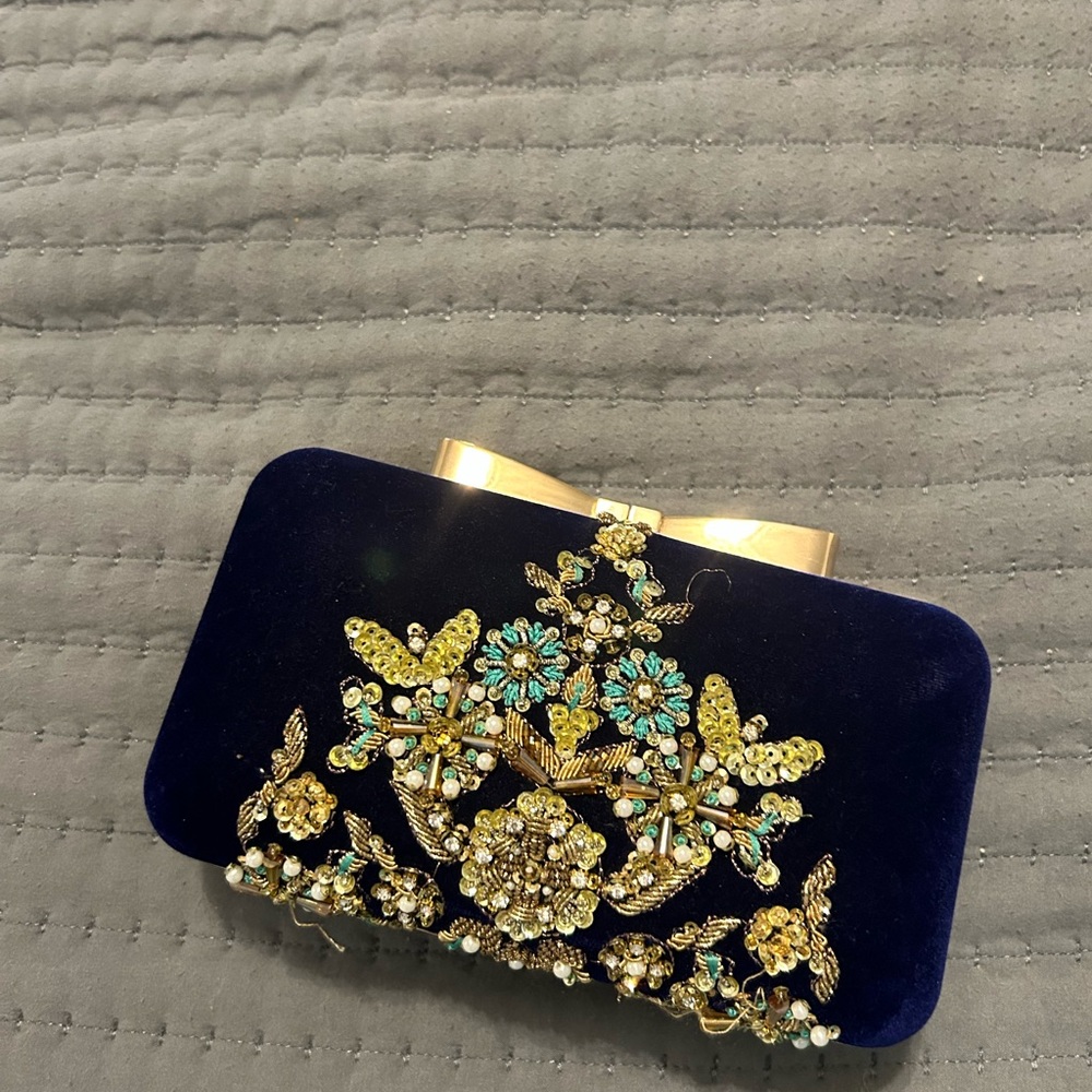 J. Junaid Jamshed Clutch